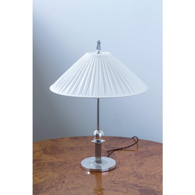 Table lamp produced by c.g hallberg by unknown designer. Made in stockholm, sweden during the 1930s. Lamp base with...