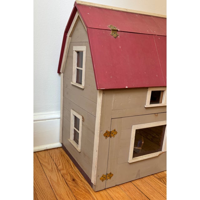 Beautiful large Colonial dollhouse with handmade furnishings, including beds, sofa and chairs, tables, and side tables,...