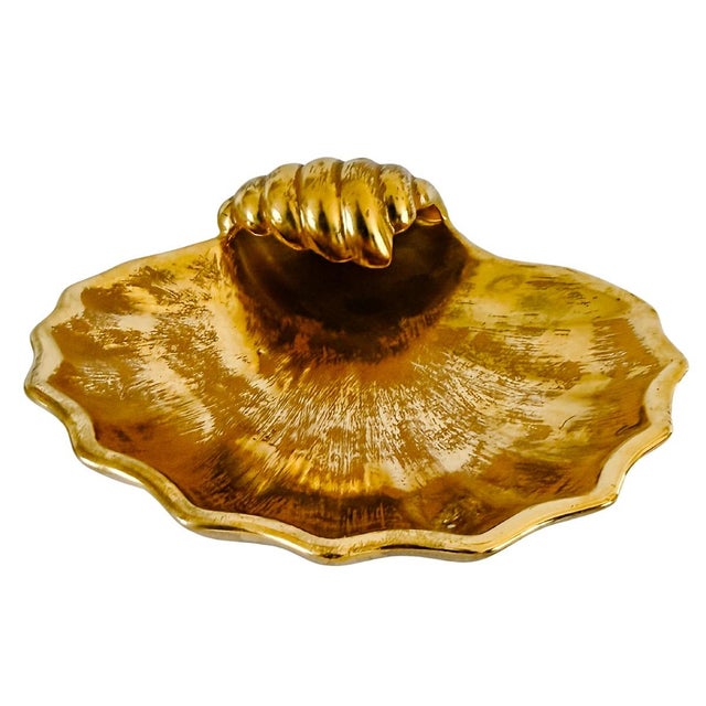 Elevate your vanity or coffee table with this striking Stangl Pottery shell-shaped dish in the luxurious Granada Gold...