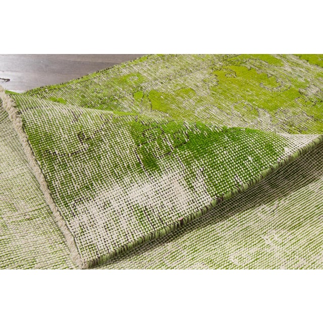 A beautiful Vintage Overdyed Handmade Wool Runner with a green field all over the distrressed design. This rug measures:...