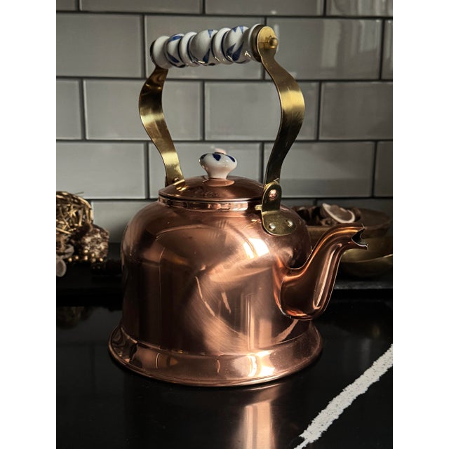 A museum-grade 1970s solid copper kettle by Ken Carter — unused, complete with its original booklet and hang tag, and...