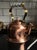A museum-grade 1970s solid copper kettle by Ken Carter — unused, complete with its original booklet and hang tag, and...