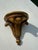 Vintage Italian Florentine-style wall bracket shelf with a distressed gilt finish and classic acanthus leaf detailing. A...