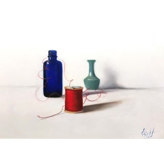 Red Thread, Two Blue by Emma Hirst | Oil Painting of bottles and a spool of red thread For Sale