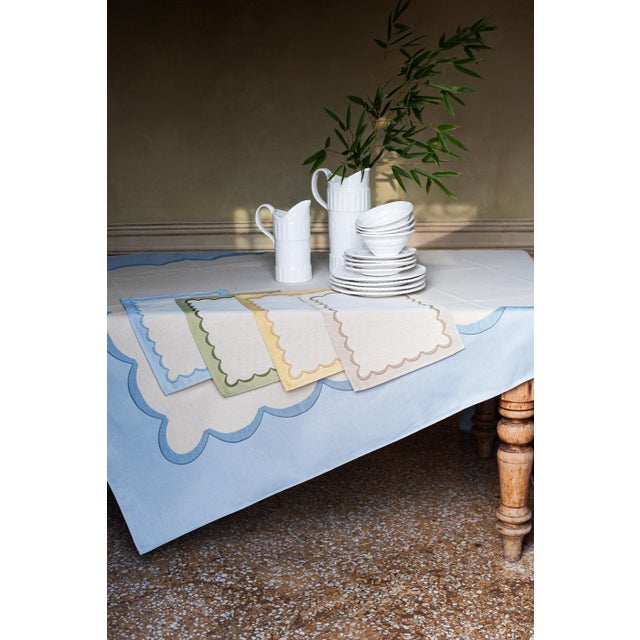 Create an inviting atmosphere with the Tavola Natural Scalloped Placemats, featuring jacquard stitching and a neutral...