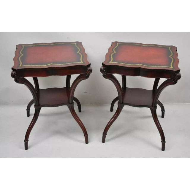 Vintage French Regency Style Red Leather Top Mahogany Lamp End Tables - a Pair. Item features red tooled leather tops,...
