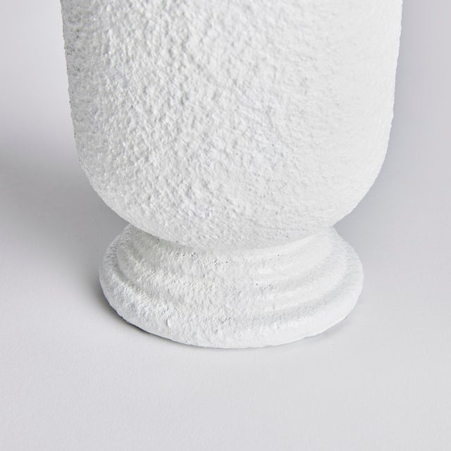 With oneofakind craftsmanship, this footed urn is a unique find. A clever juxtaposition of traditional form in a...