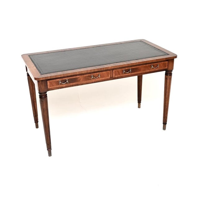 A smart and beautifully designed antique Georgian style leather top writing table / desk. This was made in England, we...