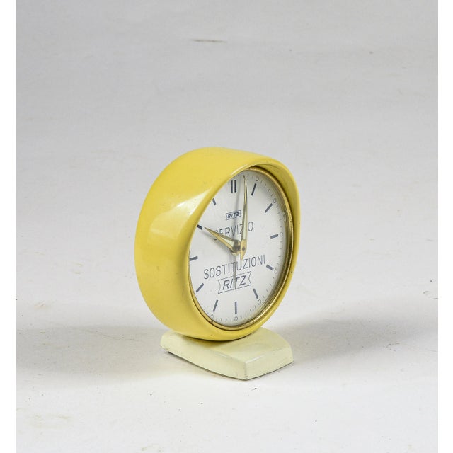 Ritz yellow replacement service alarm clock with vintage 1960's chime made of yellow enameled metal with white base. Made...