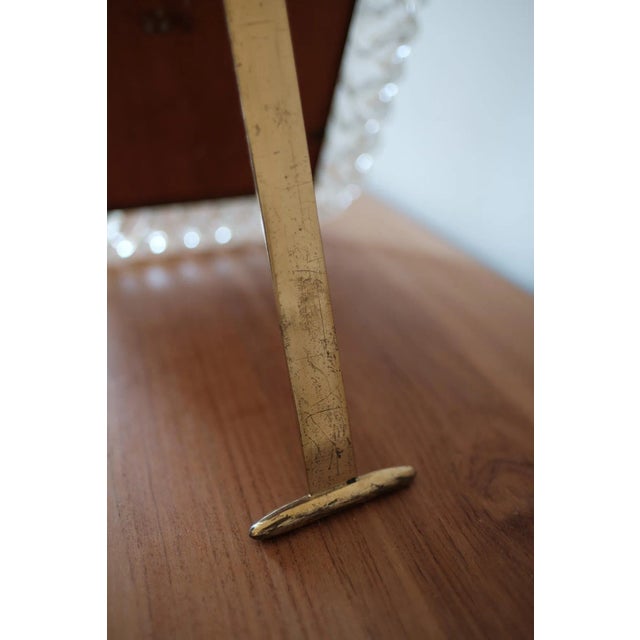 A brass and murano glass wall mirror designed and produced by Barovier & Toso, Italy, 1940s. Stunning piece of art. There...