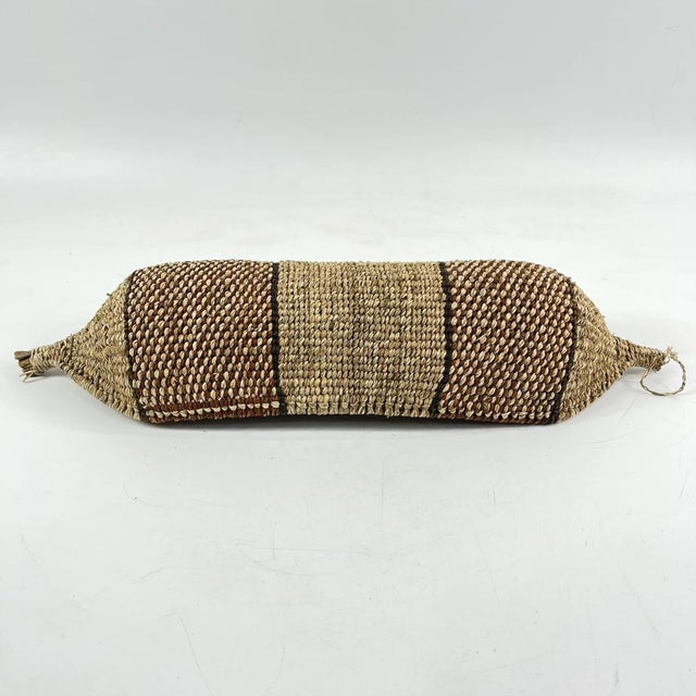 Reeds are gathered, and grasses woven around them. Many basket designs appear in different guises in different parts of...