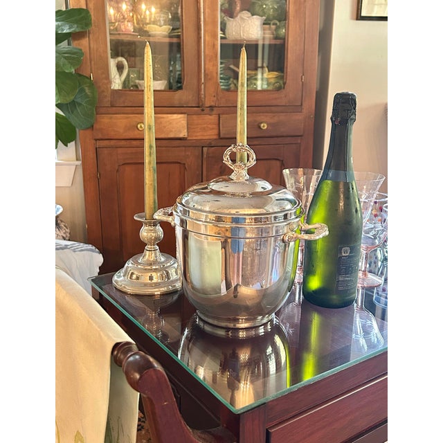 This vintage silverplate ice bucket is attributed to Sheridan/Taunton Silversmiths, dating to approximately the...