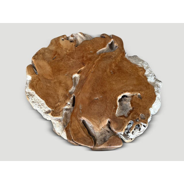 Rare century old teak wood polished on the flat sections whilst leaving the more organic sides pure in contrast. This...