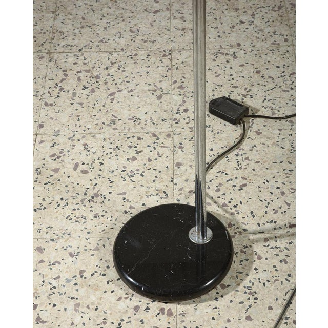 Floor lamp from Guzzini with Italian marble base, 1990. Dimensions: 34 x width 49 x depth 196 height This piece has an...