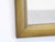 This wooden mirror with painted finish has a brass tone and measures 34.5"H x 29.5"W. It is set to hang vertically but you...