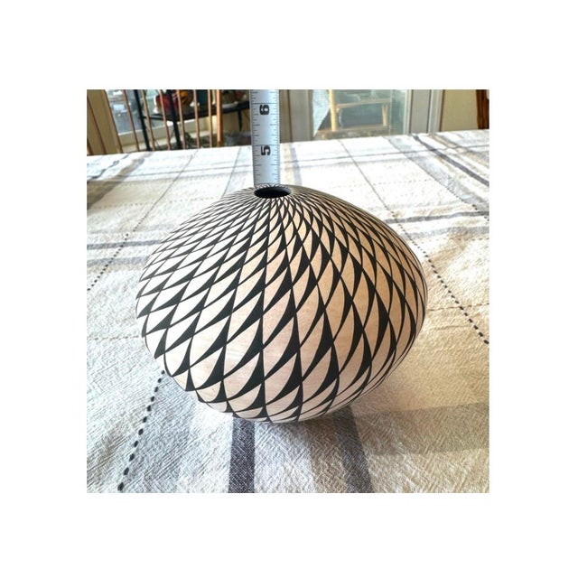Acoma Pueblo Native American pottery swirl jar crafted by artist Sandra Victorino The jar features an "op-art" style,...
