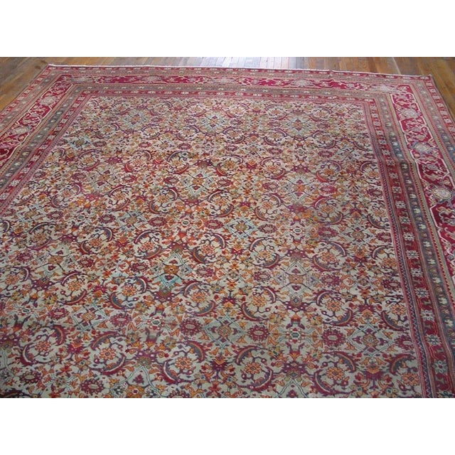 The barbed ‘fish’ leaves are the most prominent elements of the closely set Herati allover pattern on the ivory field,...