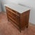 This antique four-drawer dresser represents a refined example of classic cabinetmaking, ideal for those seeking to add a...