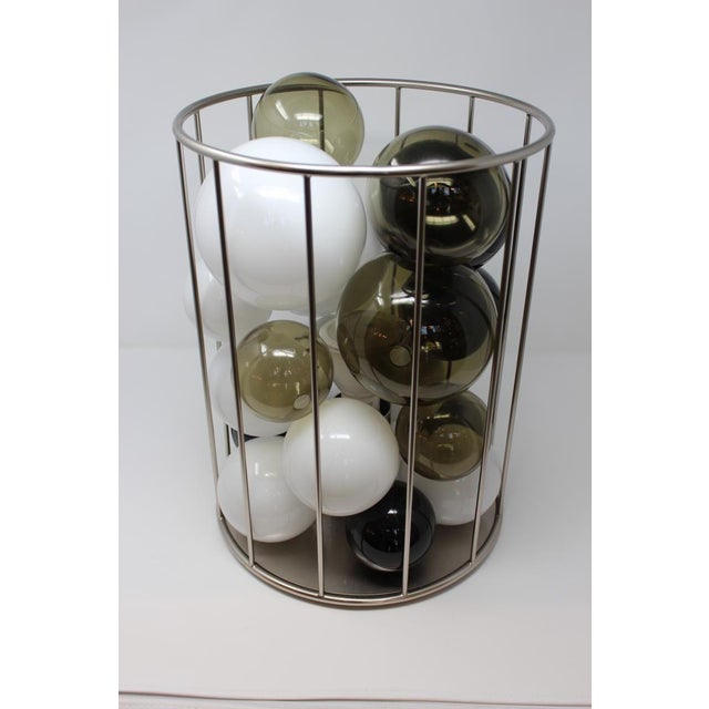 Price reduced $2,000. Now only $1,995! This fantastic lamp is made of many hand blown spheres of glass which are nestled...