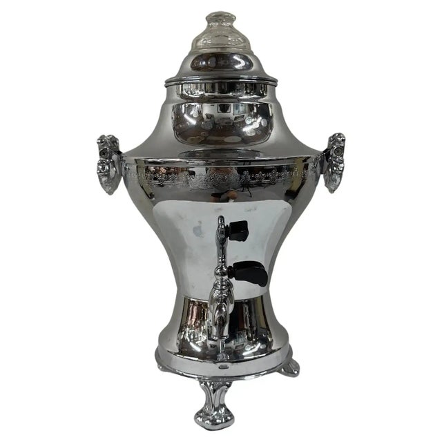 This Art Deco silver-plated samovar exemplifies elegance and timeless craftsmanship. Its graceful, bulbous form is adorned...
