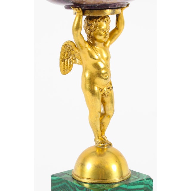 This is an impressive and highly decorative Regency Period ormolu, malachite and Blue John tazza, Circa 1820 in date. It...