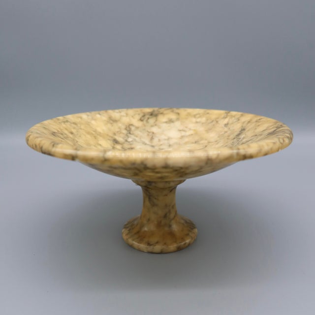The vintage hand-carved Italian alabaster tazza is a unique and elegant piece that would make a beautiful addition to any...