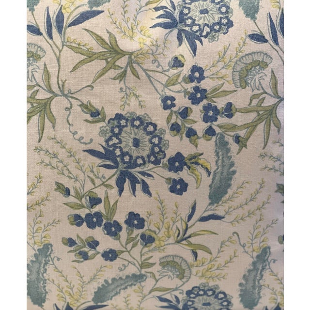 Custom-tailored botanical linen 20” feather/down pillows. Ivory background featuring exuberant blue and green flowers and...