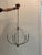 We love how this 5-light chandelier pairs distressed white wood accents and a weathered iron body for a rustic look. Its...