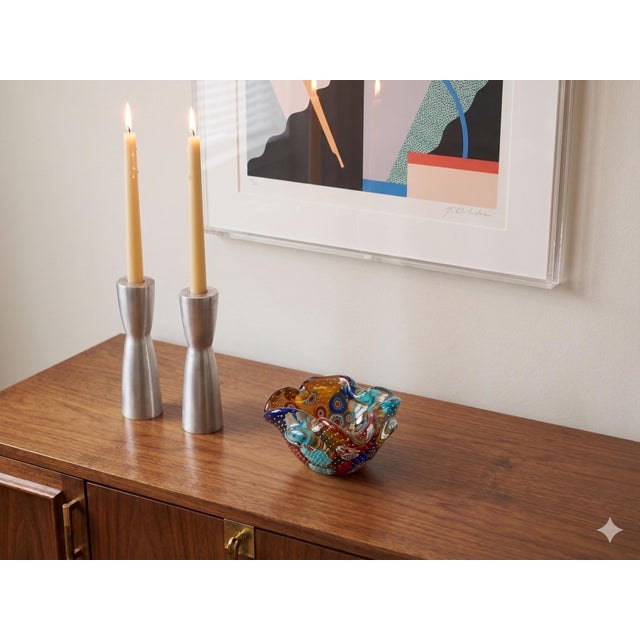 A sophisticated pair of sculptural taper candle holders designed by Erika Pekkari for the "Gota" collection. These pieces...