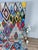 A large, vibrant Boujaad rug hand-knotted by Berber artisans in the Boujaad region of Morocco. The field is a lively...
