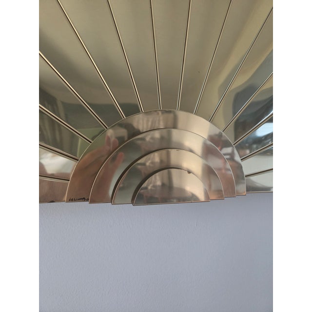 A striking Post Modern "Sunrise" fan wall sculpture by acclaimed studio Curtis Jere for Artisan House. Crafted in 1989,...
