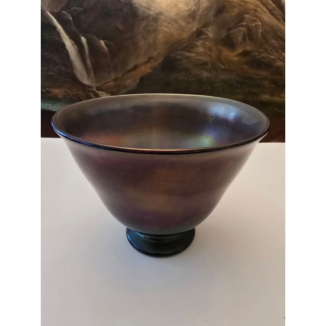 A vintage signed art glass iridescent bowl in the style of Tiffany in a glorious magenta violet royal purple color ....