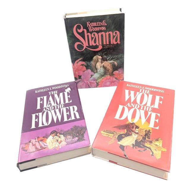 Offered are three 1st editions of the earlier romance novels by Kathleen E. Woodiwiss: The Flame and the Flower (1972),...