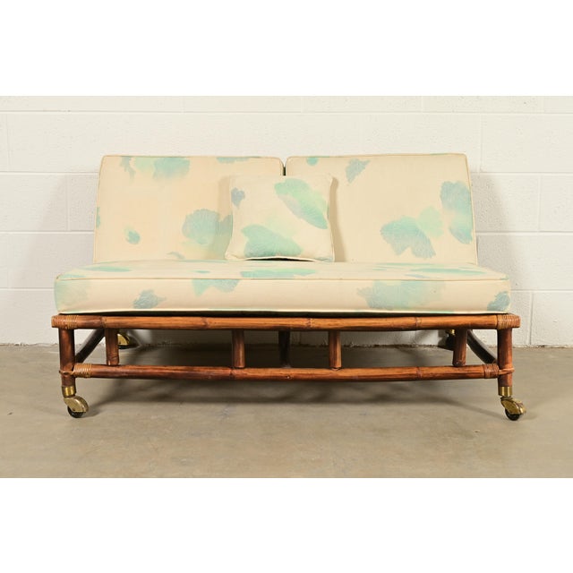 A gorgeous mid-century Hollywood Regency Organic Modern armless loveseat or settee By John Wisner for Ficks Reed, "Far...