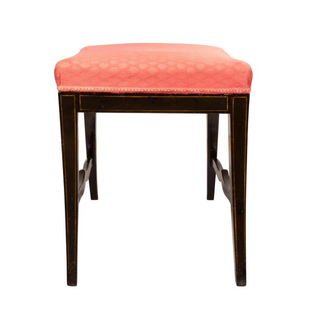 With rectangular upholstered seat. [used fabric]. With splayed legs and curved stretchers.