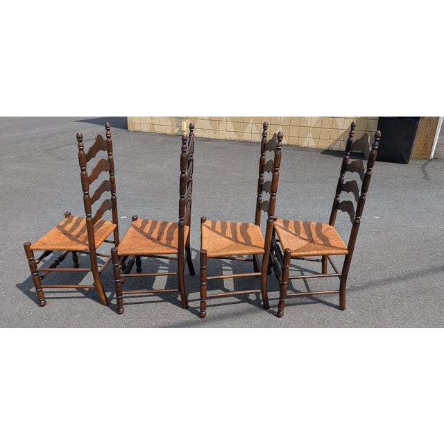 Bring timeless farmhouse or French Country charm to your dining room with this handsome set of four vintage ladder back...
