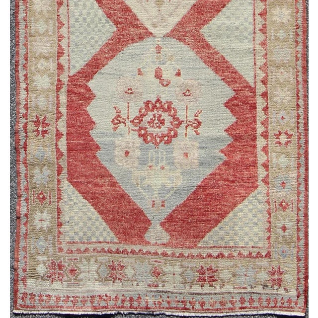Measures: 3'8'' x 9'7'' This beautiful vintage Oushak runner from 1930s Turkey features a Classic Oushak design, which is...