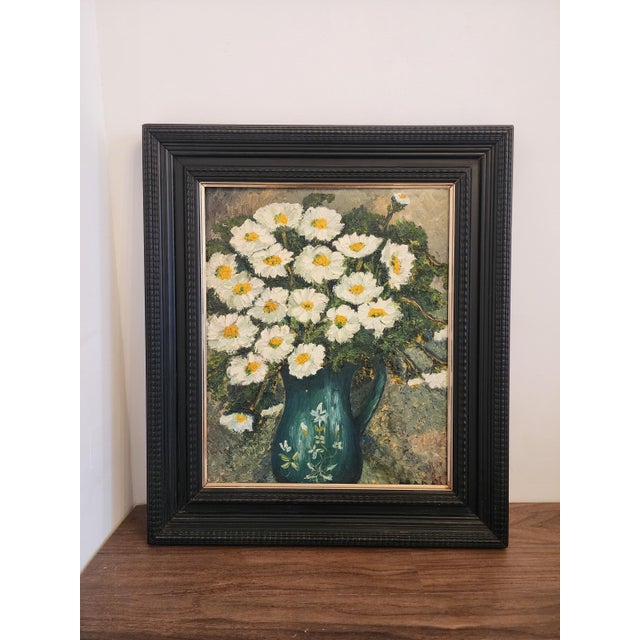 Bring warmth and charm to your space with this beautifully textured vintage floral oil painting, showcasing a bouquet of...