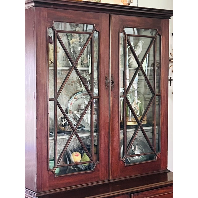 Original c. 1830, two piece Step Back cupbosrd with adjustable storage shelving for upper and lower portions. Shelving is...
