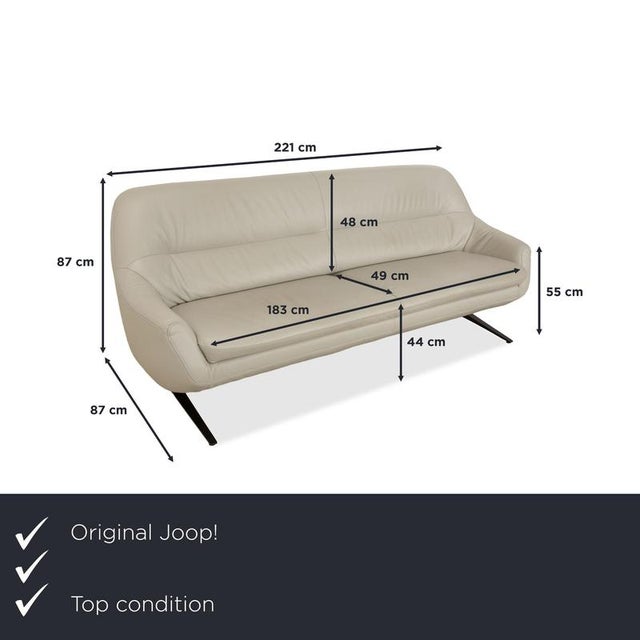 The 007 sofa by Joop! is upholstered in beige leather and rests on elegant black legs. Thanks to its high-quality leather,...