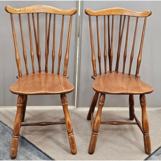 A Pair Early 20th Century Maple Fiddleback Windsor Side Chairs. Measure 20" in width and 20" in depth and 35.5" in height....