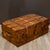 ABOUT An antique wooden cabin trunk trimmed in leather with leather handles and original travel sticker. Brass plated...