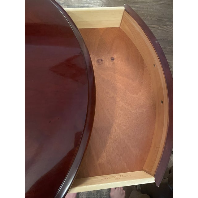 This cherry drum table is a traditional furniture piece inspired by 18th - century Georgian and Regency designs, though...