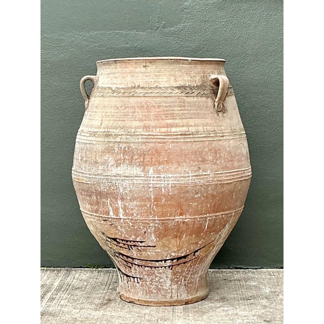 This monumental Turkish terracotta vessel is a breathtaking architectural piece that embodies the soulful, rustic...