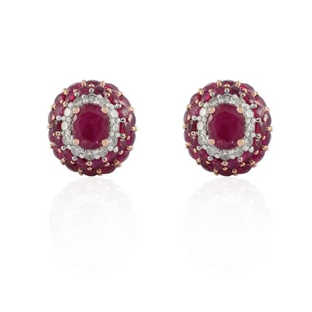Ruby and Diamond Pushback Stud Earrings in 14K gold. Embrace your look with these stunning pair of earrings suitable for...