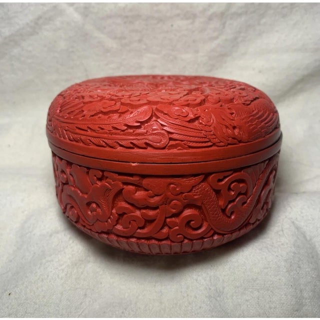 Vintage Chinese Carved Red Cinnabar Style Trinket Box with Dragons Phoenix Cloud Motif I don’t think this piece is real...