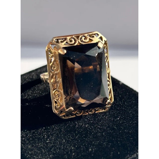 This is part of Chairish’s Fine Jewelry assortment. Rectangular Smoky Topaz 14k Yellow Gold Filigree Cocktail Ring, 15...