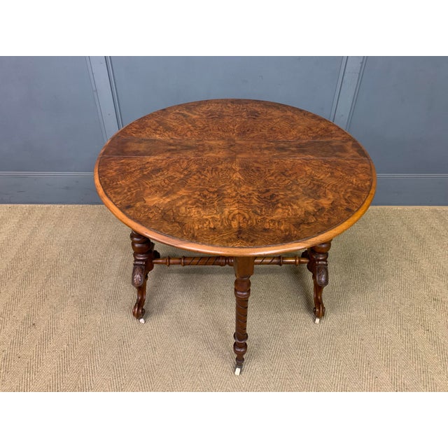 A large sized Victorian burr walnut Sutherland table. Of excellent construction in solid walnut with attractive burr...