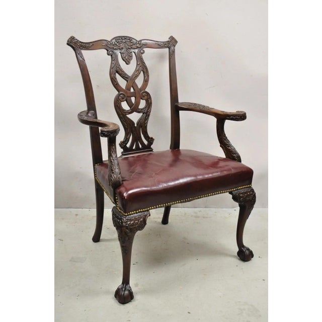 Antique Carved Mahogany Chippendale/Georgian Style Ball and Claw Leather Arm Chair. Item features solid mahogany wood...