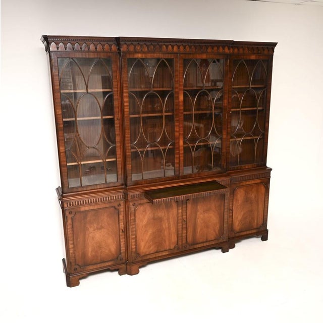 A large and impressive antique Georgian style breakfront bookcase. This was made in England, it dates from around the...